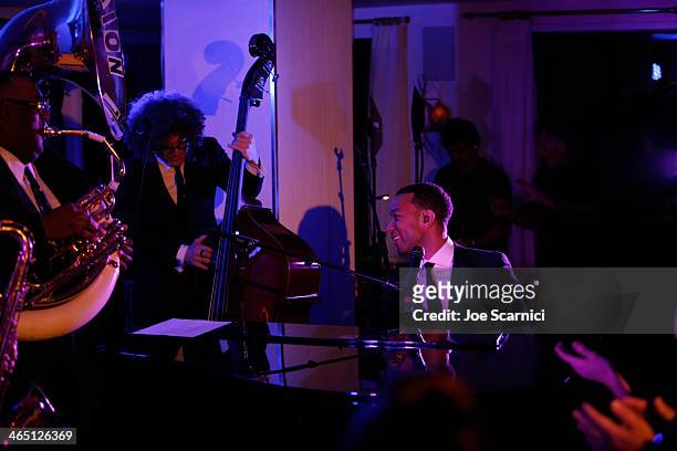 Singer/songwriter John Legend performs with Preservation Hall Jazz Band at the Nielsen Pre-GRAMMY Party at Mondrian Los Angeles on January 25, 2014...