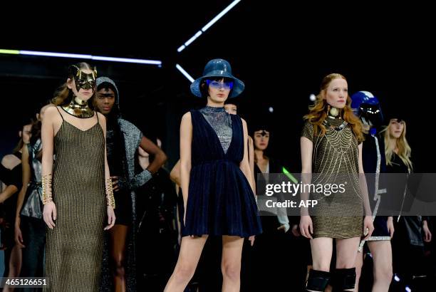 Models present creations by Dutch designer Olcay Gulsen during the SuperTrash show at the Amsterdam Fashion Week in Halfweg near Amsterdam on January...