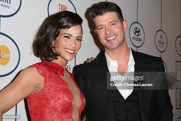 Paula Patton and singer Robin Thicke arrive at the 2014 HYUNDAI / GRAMMYs Clive Davis Pre-GRAMMY Gala Activation + Equus Fleet Arrivals at The...
