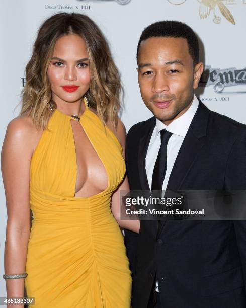Model Christine Teigen and singer John Legend attend Jason Of Beverly Hills' Pre-GRAMMY cocktail hour and salute to fashion icon David Thomas'...