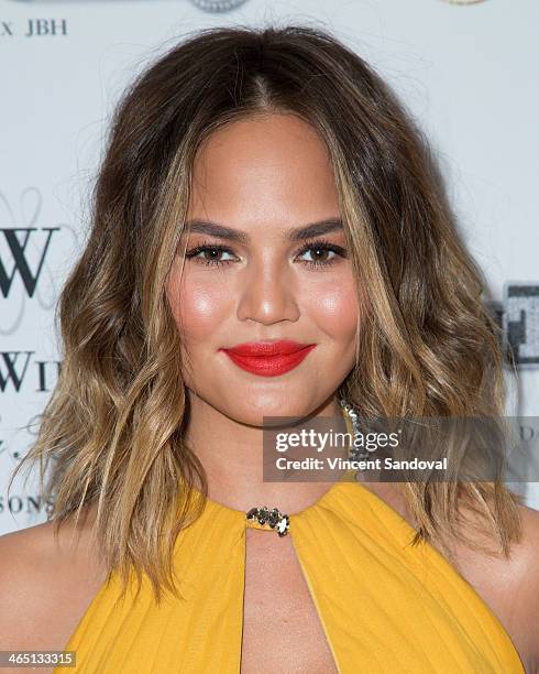 Model Christine Teigen attends Jason Of Beverly Hills' Pre-GRAMMY cocktail hour and salute to fashion icon David Thomas' Gentleman Collection at The...