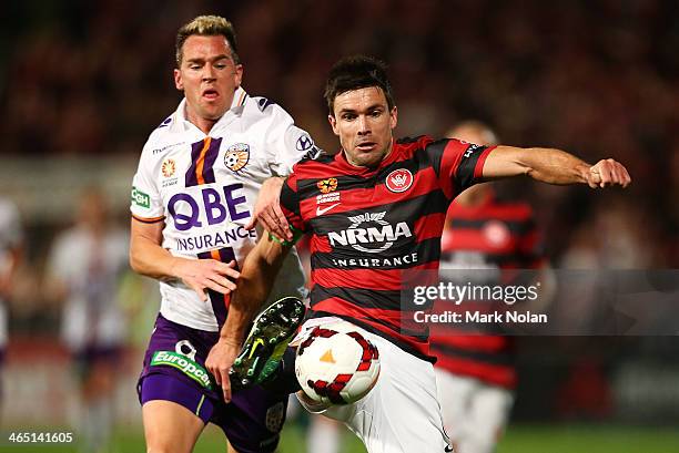 Michael Beauchamp of the Wanderers and Shane Smeltz of Perth contest possession during the round 16 A-League match between the Western Sydney...