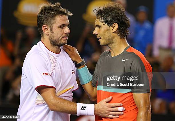 Stanislas Wawrinka of Switzerland and Rafael Nadal of Spain hug at the net after Wawrinka won their men's final match during day 14 of the 2014...