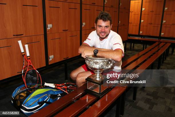 Stanislas Wawrinka of Switzerland poses with the Norman Brookes Challenge Cup in the players dressing room after winning his men's final match...