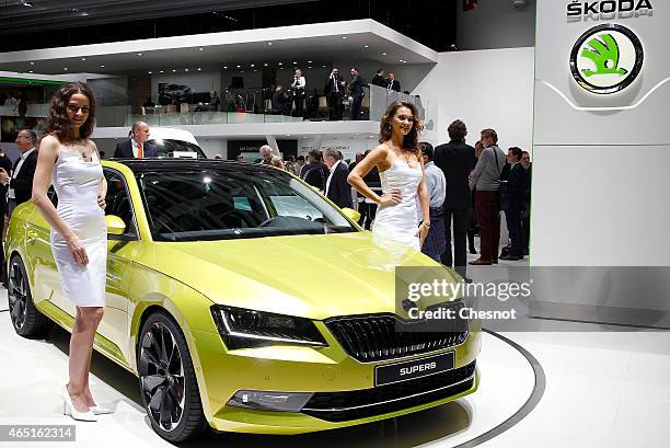 Models pose next to a Skoda Superb during the 85th Geneva International Motor Show on March 3, 2015 in Geneva, Switzerland. The International Geneva...