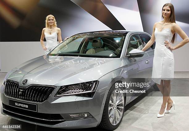 Models pose next to a Skoda Superb during the 85th Geneva International Motor Show on March 3, 2015 in Geneva, Switzerland. The International Geneva...