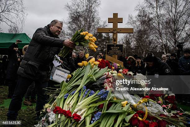 People bring flowers to the grave of Russian opposition leader Boris Nemtsov at Troyekurovskoye Cemetary on March 3, 2015 in Moscow, Russia. Nemtsov...