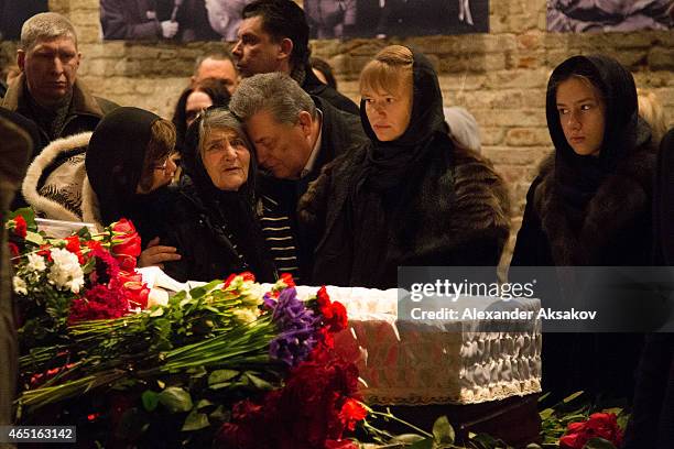 Members of Nemtsov family stand near coffin and pay their last respects at the coffin of Russian opposition leader Boris Nemtsov during a farewell...