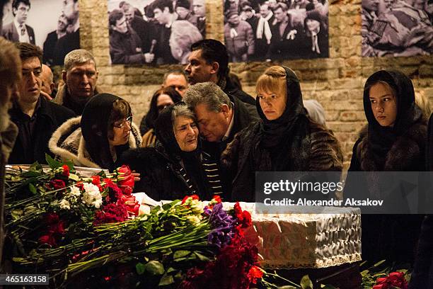 Members of Nemtsov family stand near coffin and pay their last respects at the coffin of Russian opposition leader Boris Nemtsov during a farewell...