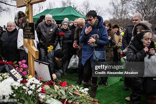 Irina Hakamada joins people bringing flowers to the grave of Russian opposition leader Boris Nemtsov at Troyekurovskoye Cemetary on March 3, 2015 in...