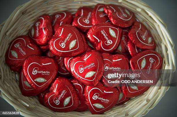 Chocolate hearts reading the name of Germany's second-biggest airline Air Berlin are on offer during a press conference of the company, on March 3,...