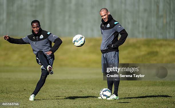 Vurnon Anita strikes the ball as Yoan Gouffran looks on during a Newcastle United Training session at The Newcastle United Training Centre on March 3...