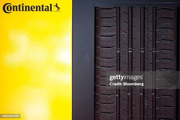 The tread pattern of a Continental ConiPremiumContact 5 automobile tyre, produced by Continental AG, sits on display on the opening day of the 85th...