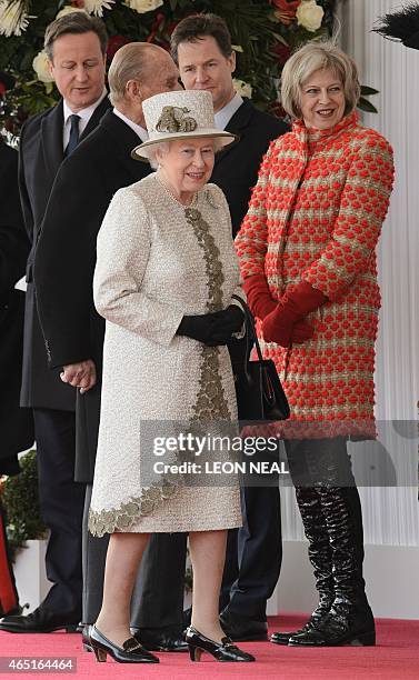 Britain's Queen Elizabeth II speaks with Home Secretary Theresa May as they await the arrival of the President of Mexico, Enrique Pena Nieto and his...