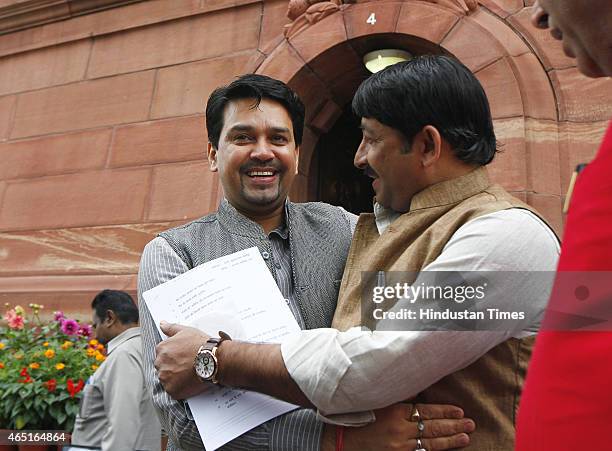 Manoj Tiwari congrats Anurag Thakur after latter won BCCI election as Secretary at the Parliament House during Budget Session on March 3, 2015 in New...