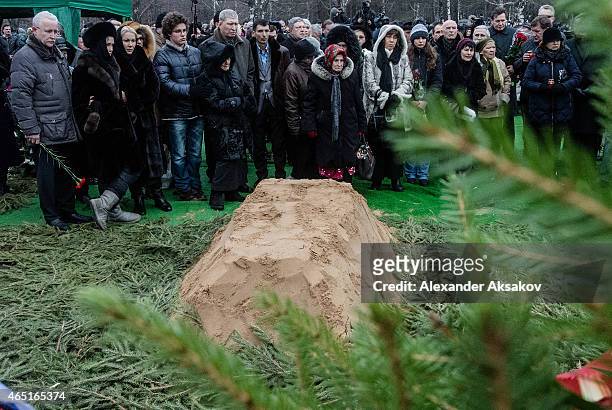People stand near the grave of Russian opposition leader Boris Nemtsov at Troyekurovskoye Cemetary on March 3, 2015 in Moscow, Russia. Nemtsov was...