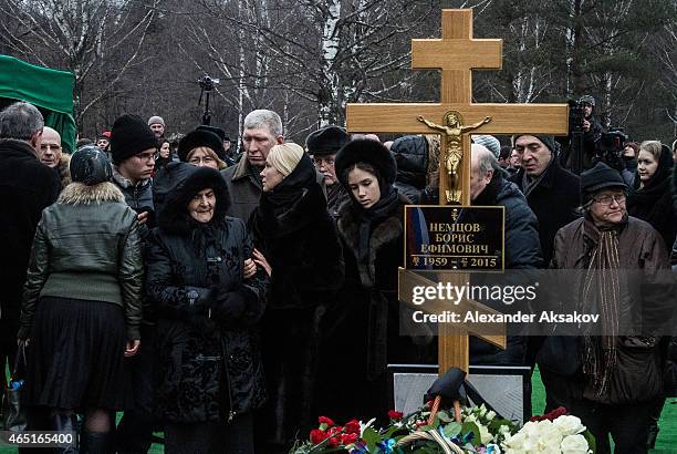 People embrace at the grave of Russian opposition leader Boris Nemtsov at Troyekurovskoye Cemetary on March 3, 2015 in Moscow, Russia. Nemtsov was...