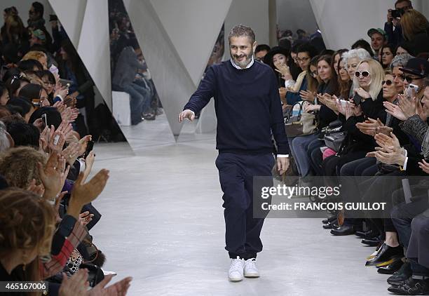 French designer Pascal Millet acknowledges the audience at the end of his fashion show during the 2015-2016 fall/winter ready-to-wear collection on...