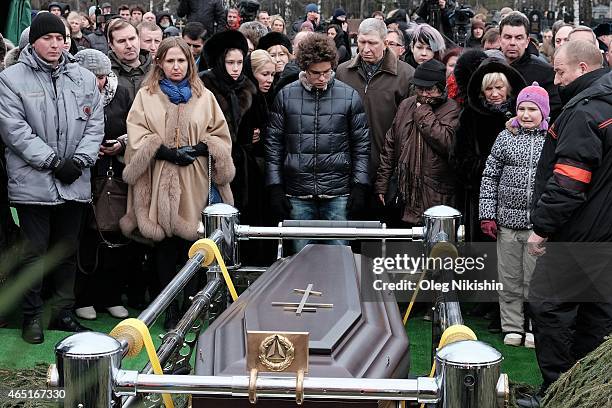 Dina Nemtsova, Ekaterina Odintsova, Anton Nemtsov near the grave of opposition leader Boris Nemtsov during his funeral at Troyekurovskoe cemetery in...