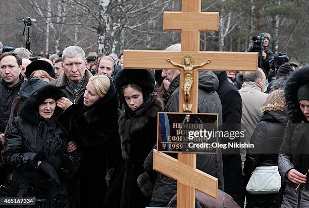 Dina Eidman Ekaterina Odintsova, Dina Nemtsova stand near the grave of opposition leader Boris Nemtsov during his funeral at Troyekurovskoe cemetery...