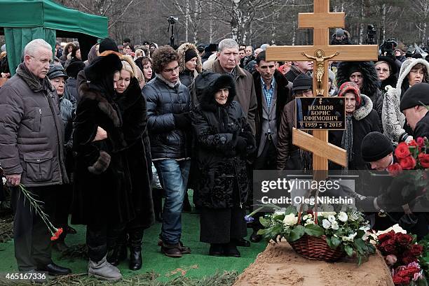 Dina Nemtsova, Ekaterina Odintsova, Anton Nemtsov, Dina Eidman, 87 near the grave of opposition leader Boris Nemtsov during his funeral at...