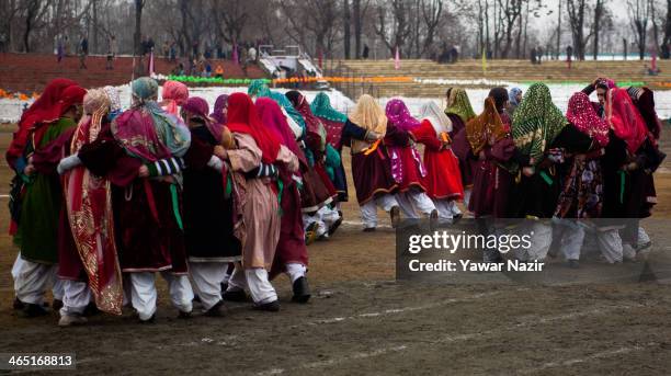 Group of Kashmiri Muslim girls in a Kashmiri traditional attire perform before the Ministers and bureaucrats at the Bakshi stadium , where the...