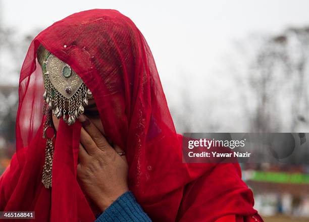 Kashmiri Muslim girl in a Kashmiri traditional attire perform before the Ministers and bureaucrats at the Bakshi stadium , where the authorities hold...