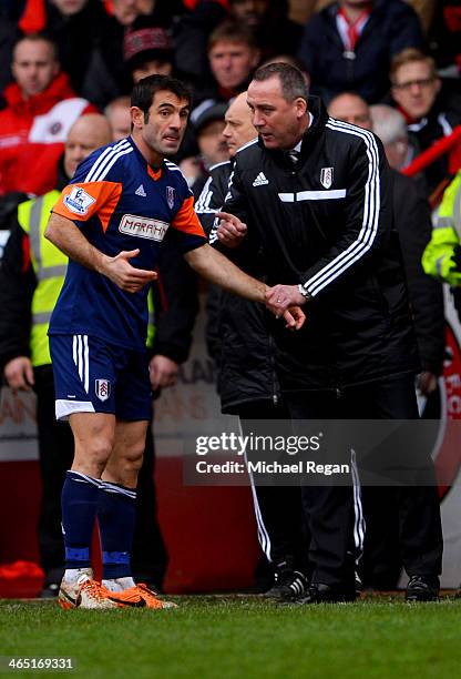 Rene Meulensteen manager of Fulham gives instructions to Giorgos Karagounis of Fulham during the FA Cup with Budweiser fourth round match between...