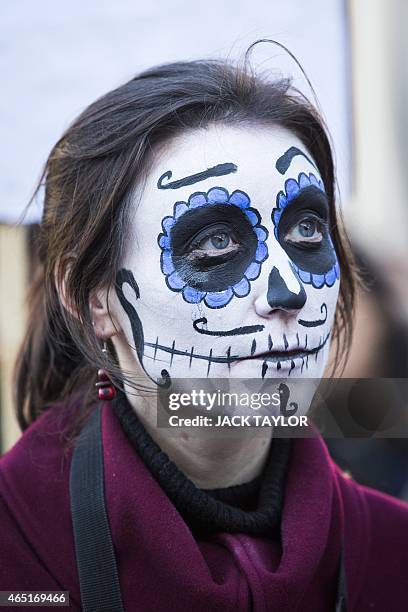 Protester with her face painted, demonstrates outside Downing Street in central London on March 3, 2015 over the abduction of 43 students in Mexico...