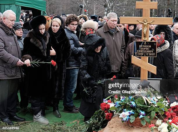 Dina Nemtsova, Ekaterina Odintsova, Anton Nemtsov and Dina Eidman mother of Boris Nemtsov lay flowers at the grave of opposition leader Boris Nemtsov...