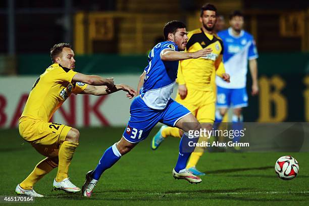 Kevin Volland of Hoffenheim eludes Arne Feick of Aalen during the DFB Cup Round of 16 match between VfR Aalen and 1899 Hoffenheim at Scholz Arena on...