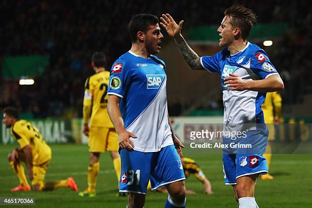 Eugen Polanski of Hoffenheim celebrates his team's first goal with team mate Kevin Volland during the DFB Cup Round of 16 match between VfR Aalen and...