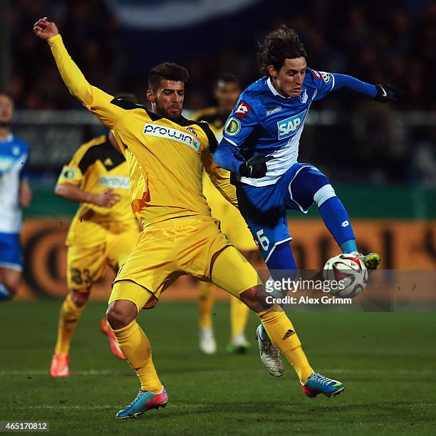 Juergen Gjasula of Aalen is challenged by Sebastian Rudy of Hoffenheim during the DFB Cup Round of 16 match between VfR Aalen and 1899 Hoffenheim at...