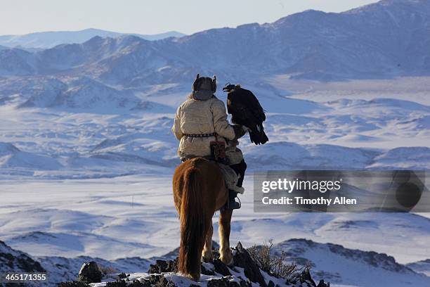 kazakh golden eagle hunter in altai mountains - hunters cap stock pictures, royalty-free photos & images