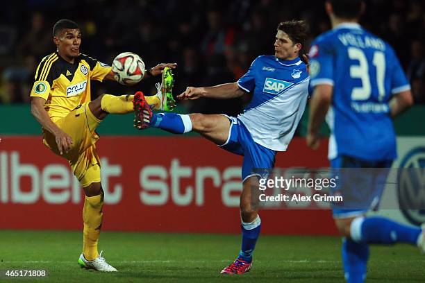 Collin Quaner of Aalen is challenged by Sebastian Rudy of Hoffenheim during the DFB Cup Round of 16 match between VfR Aalen and 1899 Hoffenheim at...