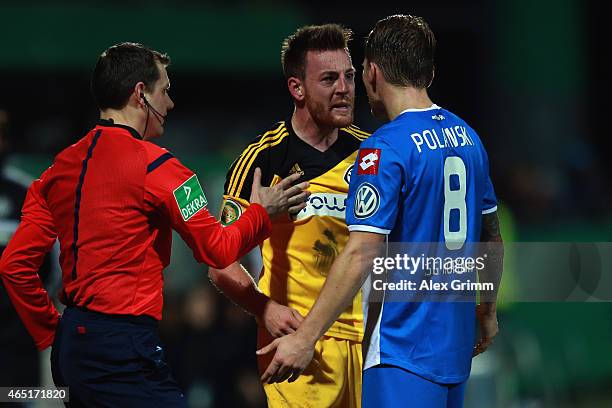 Michael Klauss of Aalen argues with Eugen Polanski of Hoffenheim during the DFB Cup Round of 16 match between VfR Aalen and 1899 Hoffenheim at Scholz...