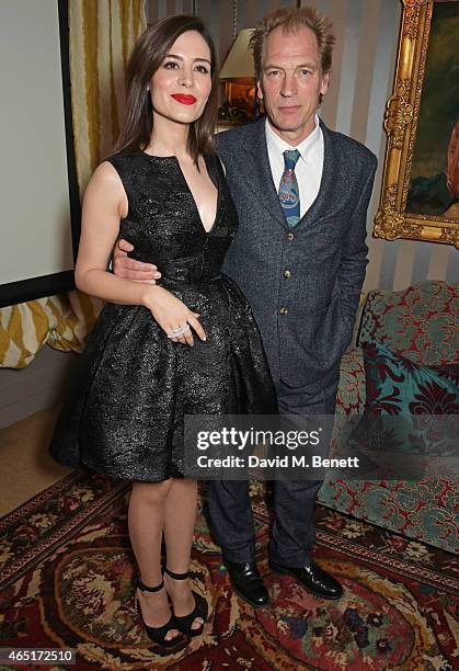 Actors Belcim Bilgin and Julian Sands attend the premiere of "A Postcard From Istanbul" directed by John Malkovich in collaboration with St. Regis...