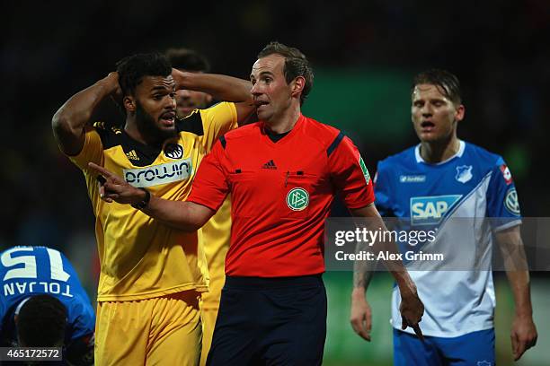 Phil Ofosu-Ayeh of Aalen discusses with referee Sascha Stegemann during the DFB Cup Round of 16 match between VfR Aalen and 1899 Hoffenheim at Scholz...