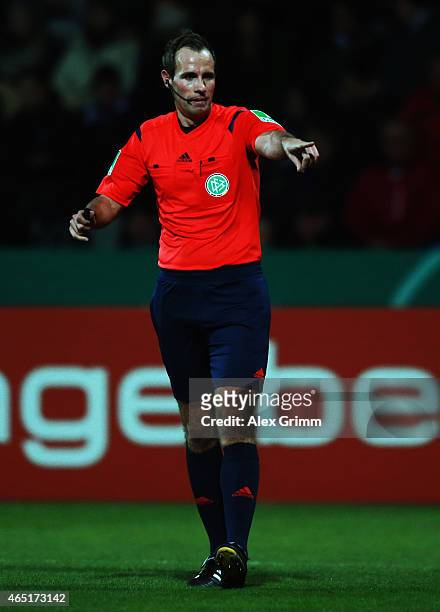 Referee Sascha Stegemann reacts during the DFB Cup Round of 16 match between VfR Aalen and 1899 Hoffenheim at Scholz Arena on March 3, 2015 in Aalen,...