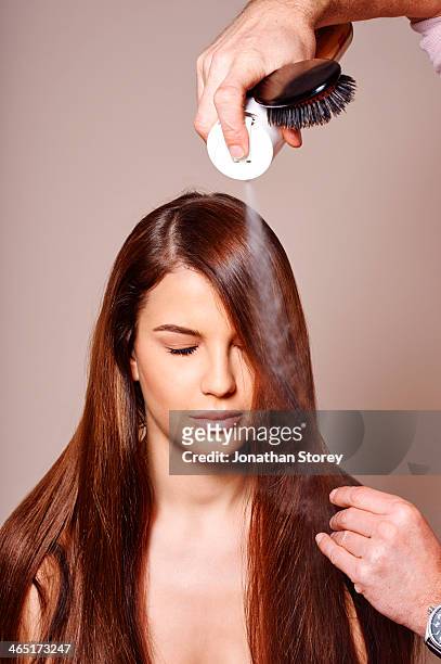 female beauty - brush in woman's hair stock pictures, royalty-free photos & images