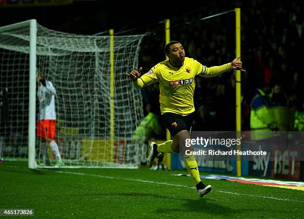 Troy Deeney of Watford celebrates scoring the first goal during the Sky Bet Championship match between Watford and Fulham at Vicarage Road on March...
