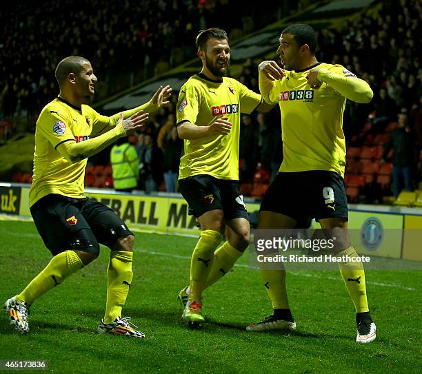 Troy Deeney of Watford celebrates scoring the first goal during the Sky Bet Championship match between Watford and Fulham at Vicarage Road on March...