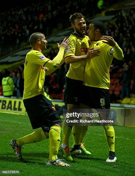 Troy Deeney of Watford celebrates scoring the first goal during the Sky Bet Championship match between Watford and Fulham at Vicarage Road on March...