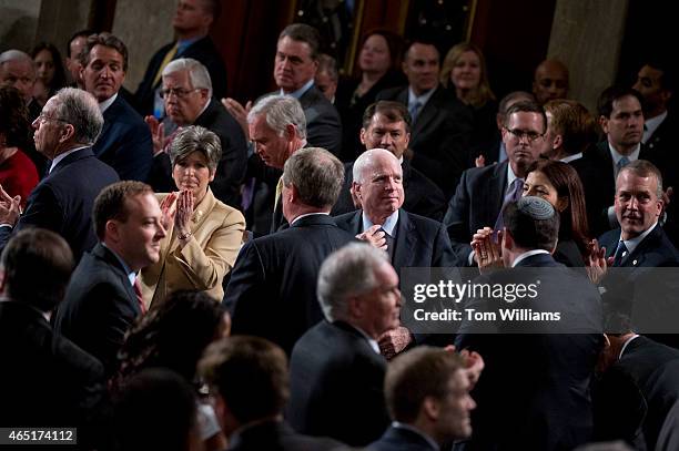 Members of Congress including Sen. John McCain, R-Ariz., applaud for Holocaust survivor Elie Wiesel during Israeli Prime Minister Benjamin...