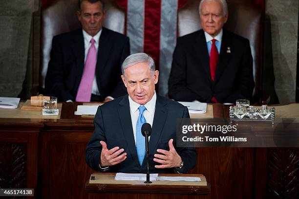 Israeli Prime Minister Benjamin Netanyahu addresses a joint meeting of Congress in the House chamber as Speaker John Boehner, R-Ohio, left, and Sen....