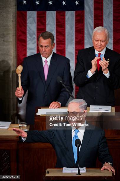 Israeli Prime Minister Benjamin Netanyahu prepares to address a joint meeting of Congress in the House chamber as Speaker John Boehner, R-Ohio, left,...
