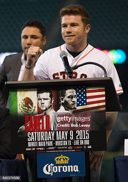 Canelo Alvarez speaks during a press conference to promote his May 9th fight against James Kirkland as Oscar De La Hoya looks on at Minute Maid Park...