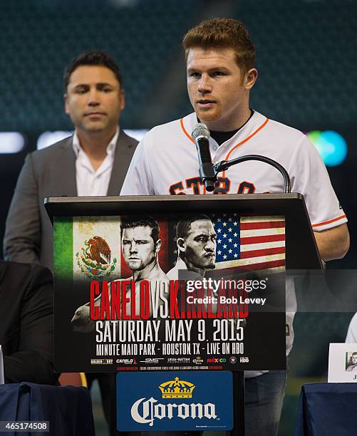 Canelo Alvarez speaks during a press conference to promote his May 9th fight against James Kirkland as Oscar De La Hoya looks on at Minute Maid Park...