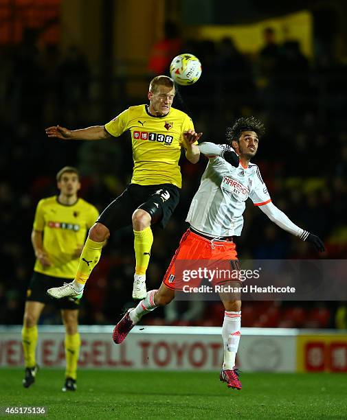 Ben Watson of Watford challenges Bryan Ruiz of Fulham during the Sky Bet Championship match between Watford and Fulham at Vicarage Road on March 3,...