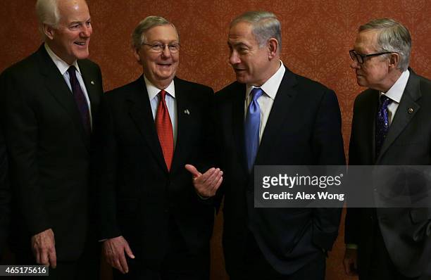 Israeli Prime Minister Benjamin Netanyahu talks to U.S. Senate Majority Leader Sen. Mitch McConnell and Senate Majority Whip Sen. John Cornyn as...